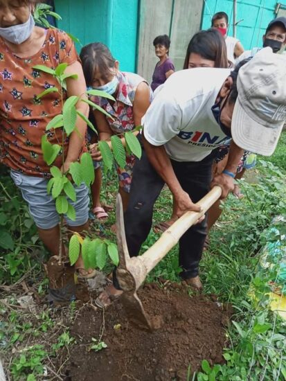 A resident of Brgy. Pansol preparing the soil for planting