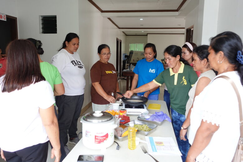 Ms. Joan Malibago participates in First 1,000 Days training, preparing complementary meals with other Barangay Nutrition Scholars