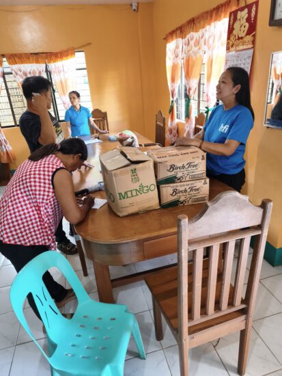 Ms. Joan endorses meal commodities to the Barangay Nutrition Scholar of Barangay Bulabud for undernourished children, pregnant and lactating women