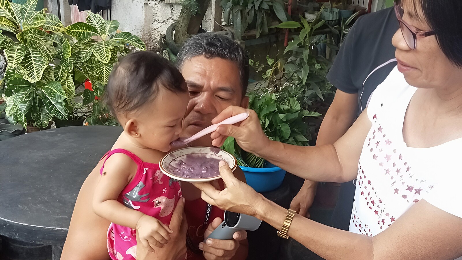 Child eating Mingo Meal to Improve Nutritional Status